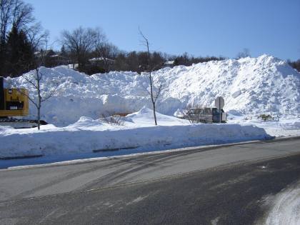 Dsc00452 from Winter 2014-15 dsc00452.jpg - Local grocery stores Snow pile before it started shipping it out of town,