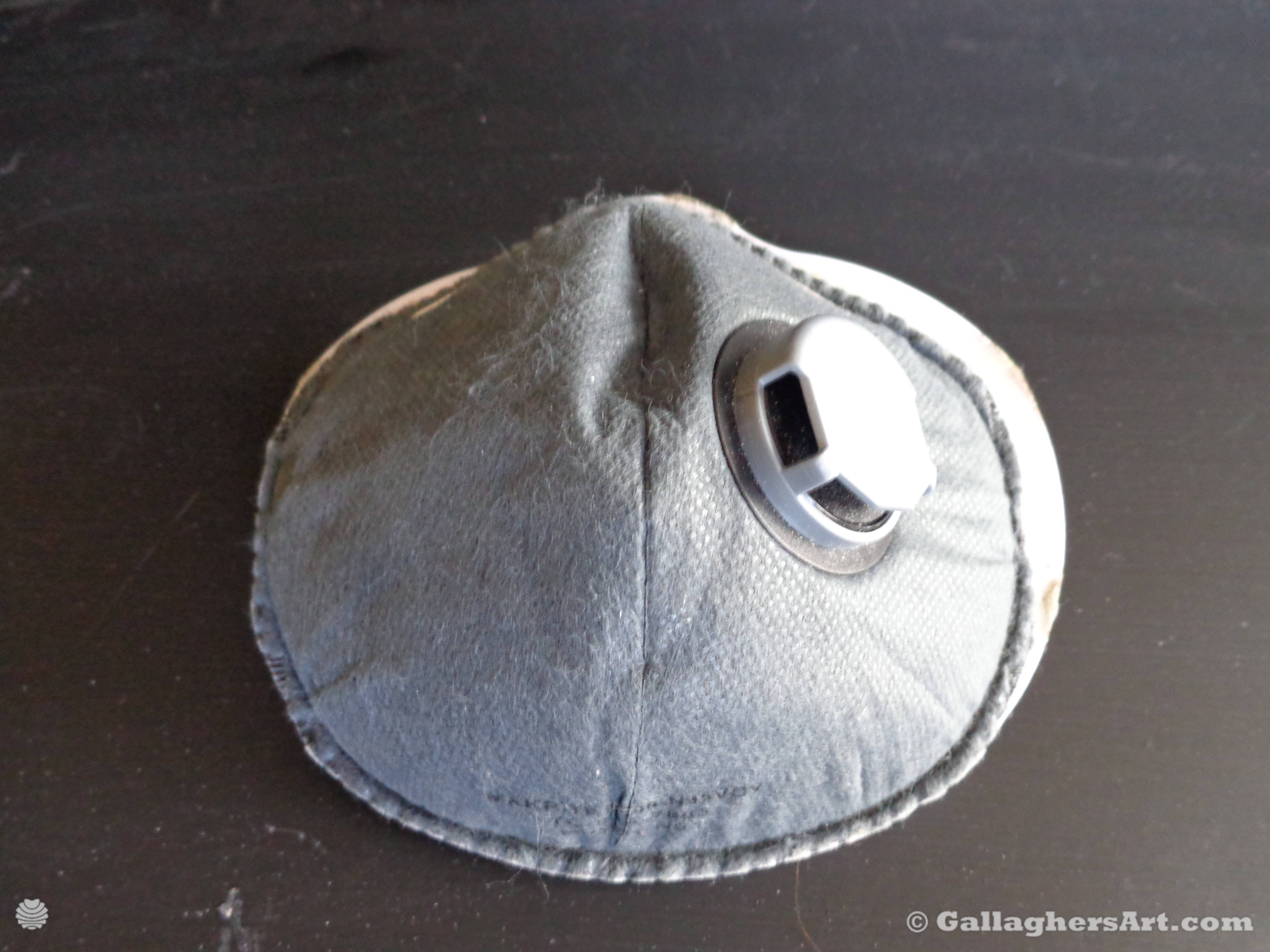 Gallaghersart airtight mask 001 dsc00339sm from Airtight adapters for Medical Masks and Face Respirators  - Version 1 N95 mask with exhale vent possible finial version cardboard with scuba adapter. Using just regular double-sided tape in these pictures from mid last year so the tape is giving out in pictures.