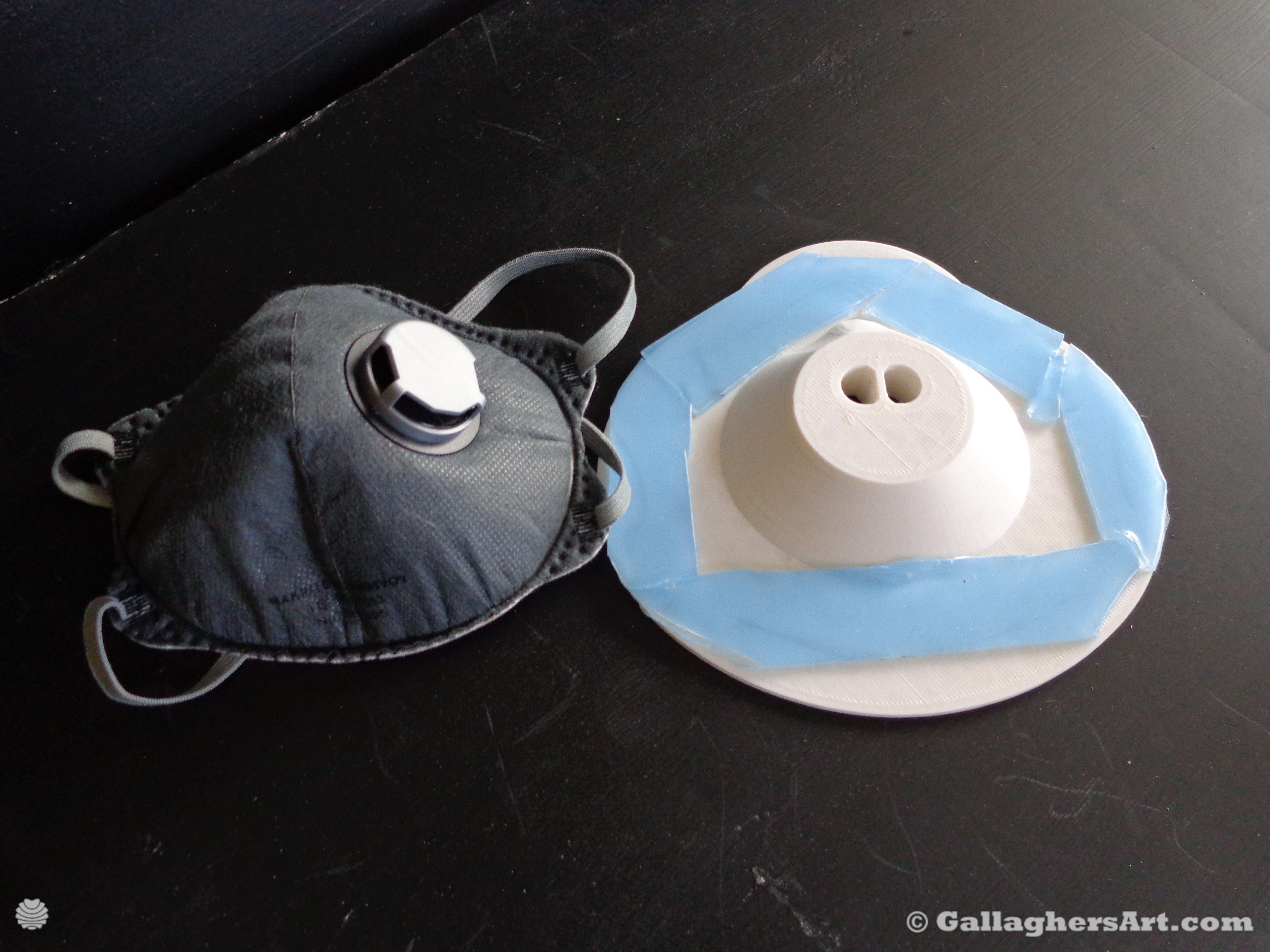 Gallaghersart airtight mask 003 dsc00346sm from Airtight adapters for Medical Masks and Face Respirators  - Place double-sided tape within and over the trace of the mask your going to use. Cover entire loop of outside of disposable mask. When mask in installed only the outside of the mask should touch device, with double sided tape between. 